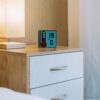 Портативная акустика Divoom Timebox-Evo на тумбочке